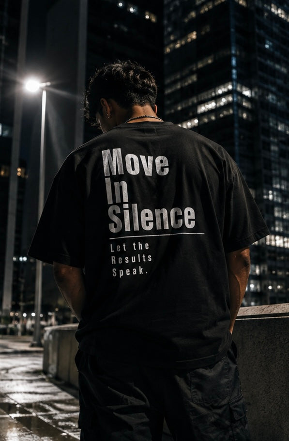     Model wearing black Move In Silence graphic T-shirt by Quietly Winning Co.
