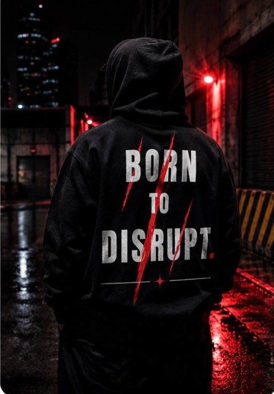     Model wearing black Born to Disrupt graphic hoodie by Quietly Winning Co.