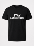 Front of black Stay Dangerous Heavyweight Graphic T-Shirt featuring Stay Dangerous text by Quietly Winning Co.